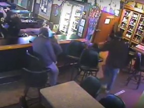A still image from video surveillance of a bar in Billings, Montana during a robbery. (YouTube/Screengrab)