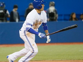 Blue Jays’ Ryan Goins connects for one of his two doubles during Wednesday night’s game against the New York Yankees. (STAN BEHAL/Toronto Sun)