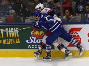 Colin Smith of the Toronto Marlies runs into Tommy Hughes  of the Hartford Wolfpack during AHL action on April 11. (Dave Abel, Toronto Sun)