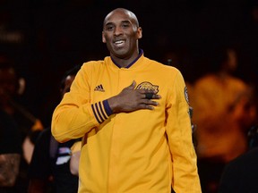 Los Angeles Lakers forward Kobe Bryant pounds his heart as he is introduced during a pre-game ceremony celebrating his 20-year NBA career at Staples Center. (Robert Hanashiro/USA TODAY Sports)