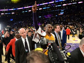 Los Angeles Lakers forward Kobe Bryant (24) acknowledges the crowd as he walks off the court at the end of the final game of his career at Staples Center in Los Angeles on April 13, 2016. The Lakers defeated the Utah Jazz 101-96. (Robert Hanashiro-USA TODAY Sports)