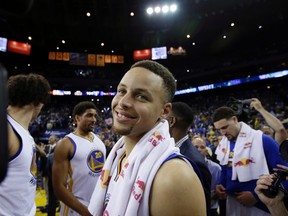 Golden State Warriors' Stephen Curry smiles a the end of a 125-104 win over the Memphis Grizzlies during an NBA basketball game Wednesday, April 13, 2016, in Oakland, Calif. (AP Photo/Marcio Jose Sanchez)