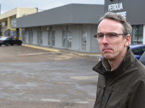 Ian Hicks, heading up an advocacy group that wants to see the Petrolia Mall revitalized and is frustrated that a lease held by Loblaws doesn't allow a potential restaurateur to develop the old mechanic building in Edmonton, April 13, 2016. (ED KAISER/PHOTOGRAPHER)