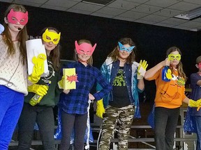 The Msgr. Morrison Bathroom Squad is seen hard at work. One of the members, Maggie, commented "but then they will know our secret identity." Pictured from left - Samantha Macdonald, Emilie Fagan, Eadie Quipp, Matthew Goodall, Marco Ostojic, Maggie Yurek, Hope Molasky.