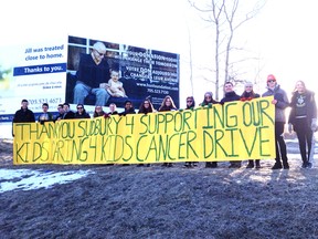 Lockerby Composite School students stand on the corner of Paris Street and Walford Road with a banner thanking Greater Sudbury for their support. Supplied photo