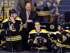 Boston Bruins coach Claude Julien looks on prior to an NHL hockey game against the Calgary Flames at TD Garden in Boston on March 1, 2016. (AP Photo/Elise Amendola)