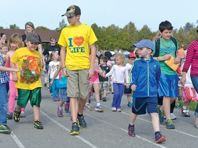 Cole Young (centre) during the 2014 Langton Relay for Life. (CHRIS ABBOTT/TILLSONBURG NEWS)