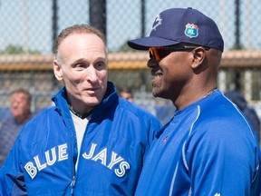 Blue Jays President Mark Shapiro (left) and Carlos Delgado chat at the team's spring training facility in Dunedin, FL, on Feb. 27, 2016. (Frank Gunn/The Canadian Press)