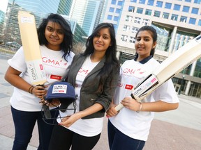 Mishuneet Sagoo, 17 (L) of West Humber Collegiate (top batsman), Riya Shah, 18, (MVP) and Perenthaa Arulnesan, 16 (top bowler), both of George Harvey Collegiate, were part of the CIMA Mayor's School Cricket Tournament awards ceremony recipients handed out to Toronto schools at Metro Hall April 14, 2016. (Jack Boland/Toronto Sun)