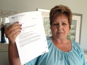 Jacqueline Miller, who was called by alleged tax scammers this week in her Kingston home with a recent tax assessment confirmation letter from the Canada Revenue Agency. Ian MacAlpine /The Whig-Standard/Postmedia Network