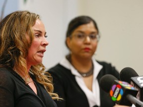 Barb Brzezicki (L), Toronto assisted dying advocate, whose mother, Stella, died this year after a long battle with dementia, speaks at a Dying With Dignity Canada press conference as Shanaaz Gokool, CEO of DWD Canada, listens Thursday, April 14, 2016. (Jack Boland/Toronto Sun)