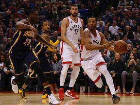 Raptors' Norman Powell (24) goes inside on Pacers' Ian Mahinmi (28) during first quarter NBA action in Toronto on Friday, April 8, 2016. The Raptors face the Pacers in the first round of the playoffs. (Jack Boland/Toronto Sun)
