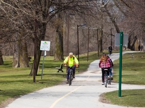 Cyclists, dog walkers and runners were out in force along the multi-use pathways through Harris Park in London, Ont. on Wednesday April 13, 2016. They were enjoying the milder weather with only better things to come in the temperature department in London. (MIKE HENSEN, The London Free Press)