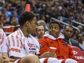 Raptors’ Kyle Lowry reacts to DeMar DeRozan wearing a cup on his head earlier this week in a game against the 76ers. (Ernest Doroszuk/Toronto Sun)