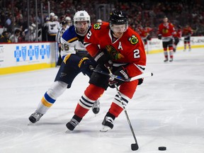 Blackhawks defenceman Duncan Keith (2) skates with the puck against Blues right wing Troy Brouwer (36) during NHL action in Chicago on Jan. 24, 2016. (Mike DiNovo/USA TODAY Sports)