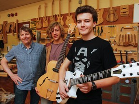 Hard work from the students in the Guitar Building Focus Program led to their work gracing the cover of the Lee Valley Spring 2016 catalogue. Teacher Gary Pattenden, left, seen here with students Antoine Mercier and Noah Garofalo show off two different styles of guitars completed during the fall semester at Kingston Collegiate in Kingston. The students will be showing off their work at a demonstrations in the Lee Valley Kingston store from April 21 to 24. Julia McKay/The Whig-Standard/Postmedia Network