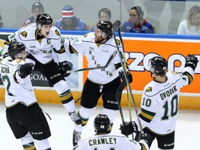 London Knights forward Mitch Marner leaps through the air as he celebrates his third period goal against the Kitchener Rangers with teammates during game 4 of their OHL playoff hockey series at the Kitchener Memorial Auditorium in Kitchener, Ont. on Thursday April 14, 2016. The Knights won the series with a 6-4 victory over the Rangers.  (CRAIG GLOVER, The London Free Press)