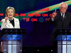 Democratic U.S. presidential candidates Hillary Clinton (L) and Bernie Sanders both gesture during a Democratic debate hosted by CNN and New York One at the Brooklyn Navy Yard in New York April 14, 2016. REUTERS/Lucas Jackson
