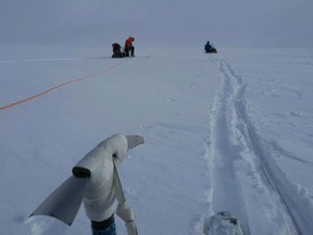 This Monday, April 11, 2016, photo provided by the Alaska Air National Guard shows a four-man guard rescue team skiing on top of the Harding Ice Field in Alaska. The team was dropped off on the ice field on Monday, to help rescue two stranded skiers, Christopher Hanna and Jennifer Neyman, on the ice field and hunkered down in a snow cave. (Senior Airman Allen-Mikel Armstrong/Alaska Air National Guard via AP)