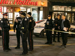 Toronto Police investigate a shooting on Yonge St., just north of Bloor St. on April 13, 2016. (Craig Robertson/Toronto Sun)