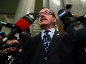 Progressive Conservative leader Ric McIver speaks to the media after the NDP delivered the 2016/2017 provincial budget at the Alberta Legislature, in Edmonton Alta. on Thursday April 14, 2016. Photo by David Bloom