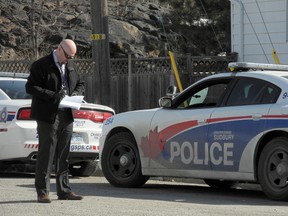 Greater Sudbury Police canvassed neighbours Friday morning following a man's death at a residence on Victoria Street in Sudbury on Thursday evening. Police say an adult male's body was found and they were treating his death as suspicious, but later ruled there was no foul play. Carol Mulligan/The Sudbury Star/Postmedia Network