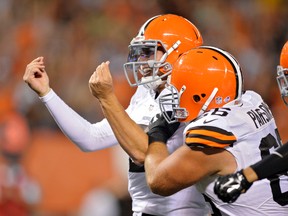 In this Aug. 23, 2014, file photo, Cleveland Browns quarterback Johnny Manziel celebrates after a touchdown run against the St. Louis Rams during a pre-season NFL football game, in Cleveland. (AP Photo/David Richard, File)