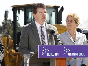 Premier Kathleen Wynne, with Geoff Wilkinson of Ontario Road Builders' Association, announced $2.1 Billion in road and bridge construction across Ontario in Mississauga on April 15, 2016. The highlight in the GTA being the widening of Hwy. 401 in Mississauga. (Jack Boland/Toronto Sun)