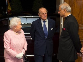 Queen Elizabeth II and Prince Philip, the Duke of Edinburgh (C) are greeted by the Commonwealth Secretary-General, Kamalesh Sharma at the annual Commonwealth Day reception at Marlborough House in London, March 14, 2016. REUTERS/Dominic Lipinski/Pool