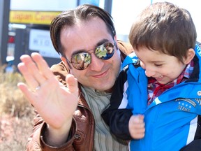 TIM MILLER/the Intelligencer
Four-year-old Manny Jamjekian, seen here with his father Garo, were among dozens of protesters at a rally contesting the change in Ontario's autism strategy which, among other things, adds a cut off for eligibility at five years old. With those changes Manny will be ineligible for the same treatment which helped his older brother Gabriel, also on the autism spectrum.