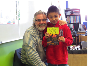 Grade 4 student Chase Gordon with David Bouchard, last year, during Bouchard’s visit to Mother Earth’s Children’s Charter School - Photo submitted.