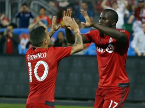 TFC's Sebastian Giovinco and Jozy Altidore celebrate a goal last season. (USA TODAY SPORTS)