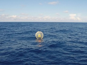 This October 4, 2014  file US Coast Guard handout photo shows the Coast Guard Cutter Bernard C. Webber arriving on scene off the coast of Miami to respond to a report of a man aboard an inflatable hydro bubble who needed assistance.  AFP PHOTO / HANDOUT / US Coast Guard  / PO3 Mark Bar/ Files