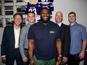Rob Kochel, Craig Butler, Vaughn Martin, Irv Daymond and Jeff Keeping are the newest Western Mustang football players to be honour on the Wall of Champions at TD Stadium in London, Ont. on Friday April 15, 2016. (DEREK RUTTAN, The London Free Press)