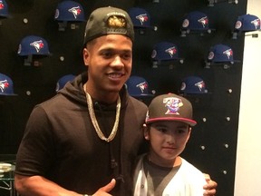 Aaryan Dinh-Ali, 10, poses with Toronto Blue Jays pitcher Marcus Stroman in this undated handout photo. Dinh-Ali, diagnosed with a rare bone marrow disease called aplastic anemia, has received roughly 90 blood transfusions from more than 3,000 donors since being admitted to Sick Kids Hospital in November. (Handout/Postmedia Network)