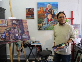 Navajo artist Bahe Whitethorne, Jr. describes Flagstaff's lively art scene while painting at a cooperative downtown studio. Flagstaff, Arizona (Barbara Taylor London Free Press/Postmedia News)