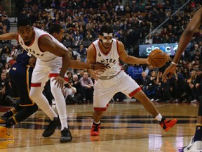 Raptors' Cory Joseph (6), wearing the protective mask, drives to the key against the Pacers during first quarter NBA action in Toronto on Saturday April 9, 2016. (Jack Boland/Toronto Sun)