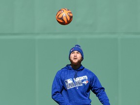 Toronto Blue Jays catcher Russell Martin warms up with a soccer ball prior to a game against the Boston Red Sox at Fenway Park on April 15, 2016. Martin struck out as a pinch-hitter in the game, leaving him with a .067 batting average. (BOB DeCHIARA/USA TODAY Sports)