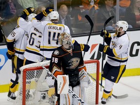 Anaheim Ducks goalie John Gibson reacts after Nashville Predators celebrate after Filip Forsberg scored during the third period of Game 1 in an NHL hockey Stanley Cup playoffs first-round series in Anaheim, Calif., Friday, April 15, 2016. Nashville won 3-2.