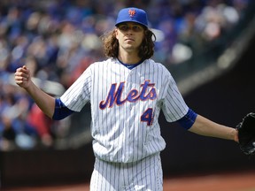 Mets pitcher Jacob deGrom has been with his wife and newborn son since his birth on Monday. (Julie Jacobson/AP Photo)