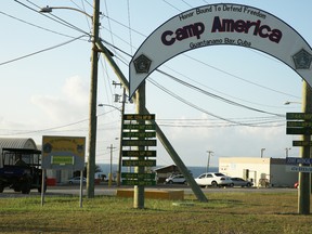 In this photo taken Feb. 2, 2016, the entrance to Camp America is seen at U.S. Guantanamo Naval Base, Cuba. Authorities say the U.S. has released nine prisoners from Guantanamo Bay and sent them to Saudi Arabia for resettlement. (AP Photo/Ben Fox)