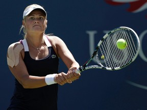 Canada's Aleksandra Wozniak (pictured) fell to Anna Karolina Schmiedlova of Slovakia in Fed Cup action in Bratislava, Slovakia on Saturday. (Frank Franklin II/AP Photo/Files)