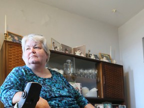 Catherine Porter wears a boot to help her right foot heal. A diabetic ulcer on her left foot became so bad doctors were forced to amputate it. (Veronica Henri/Toronto Sun/Postmedia Network)