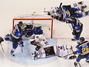 Blackhawks right wing Andrew Shaw (65) reacts after scoring past Blues goaltender Brian Elliott during the third period of their NHL playoff game in St. Louis on Friday, April 15, 2016. (Chris Lee/St. Louis Post-Dispatch via AP)