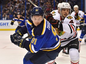 Blackhawks defenceman Niklas Hjalmarsson (right) pressures Blues right wing Vladimir Tarasenko (left) during the second period in Game 1 of their first round playoff series in St. Louis on Wednesday, April 13, 2016. (Jasen Vinlove/USA TODAY Sports)