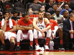 Toronto's bench looks glum near the end of the game as the Indiana Pacers  defeated the Toronto Raptors 100-90 in the first game of the NBA playoffs in Toronto, Ont. on Saturday April 16, 2016. Michael Peake/Toronto Sun/Postmedia Network