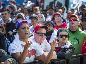 Toronto Raptors fans react towards the end of a losing NBA playoff game against the Indiana Pacers watch  while watching the game on a giant screen outside of the Air Canada Centre at Maple Leaf Square in Toronto, Ont.  on Saturday April 16, 2016. Ernest Doroszuk/Toronto Sun/Postmedia Network