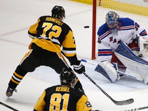Rangers goalie Henrik Lundqvist (30) stops a shot by Penguins' Patric Hornqvist (72) during the first period in Game 2 in their first round NHL playoff action in Pittsburgh on Saturday, April 16, 2016. (Gene J. Puskar/AP Photo)