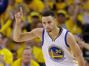 Golden State Warriors' Stephen Curry celebrates after scoring against the Houston Rockets during the first half in Game 1 of a first-round NBA basketball playoff series Saturday, April 16, 2016, in Oakland, Calif. (AP Photo/Marcio Jose Sanchez)