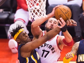 Raptors' Jonas Valanciunas (17) battles for the ball against Pacers' Myles Turner (33) during first half NBA playoff action in Toronto on Saturday, April 16, 2016. (Nathan Denette/THE CANADIAN PRESS)